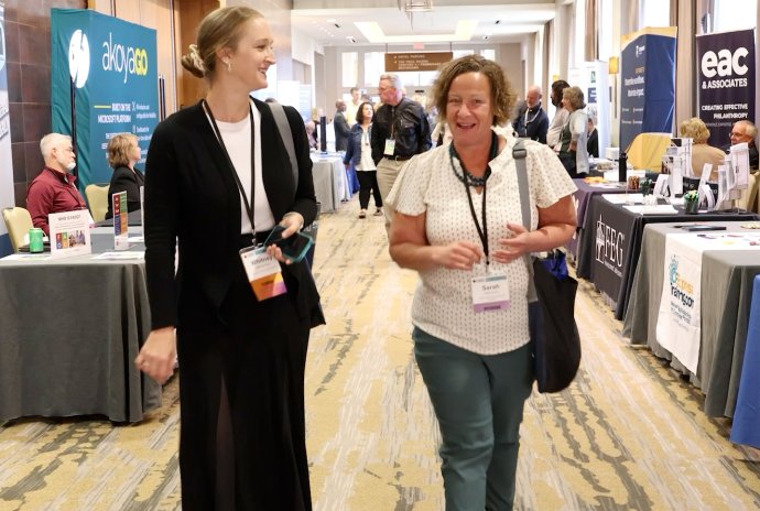 Two women networking at a conference